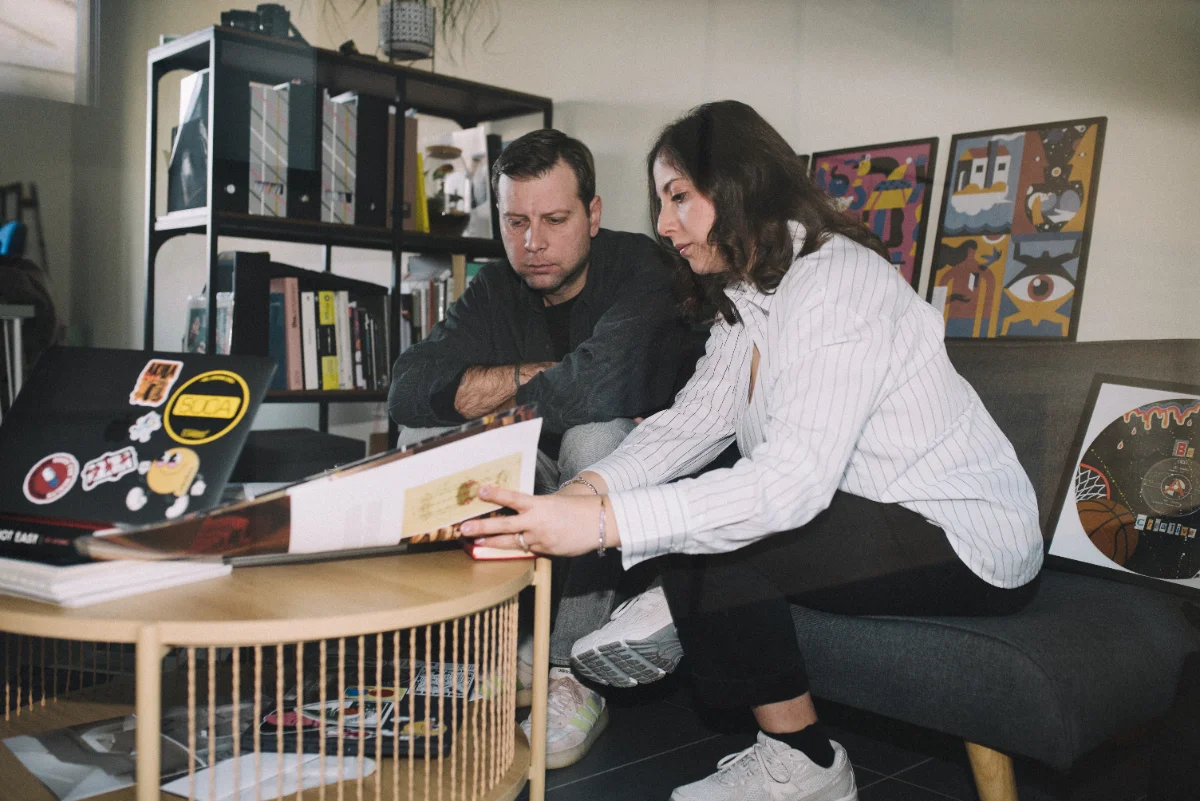 Martina & Paulius together, standing by the table in the studio